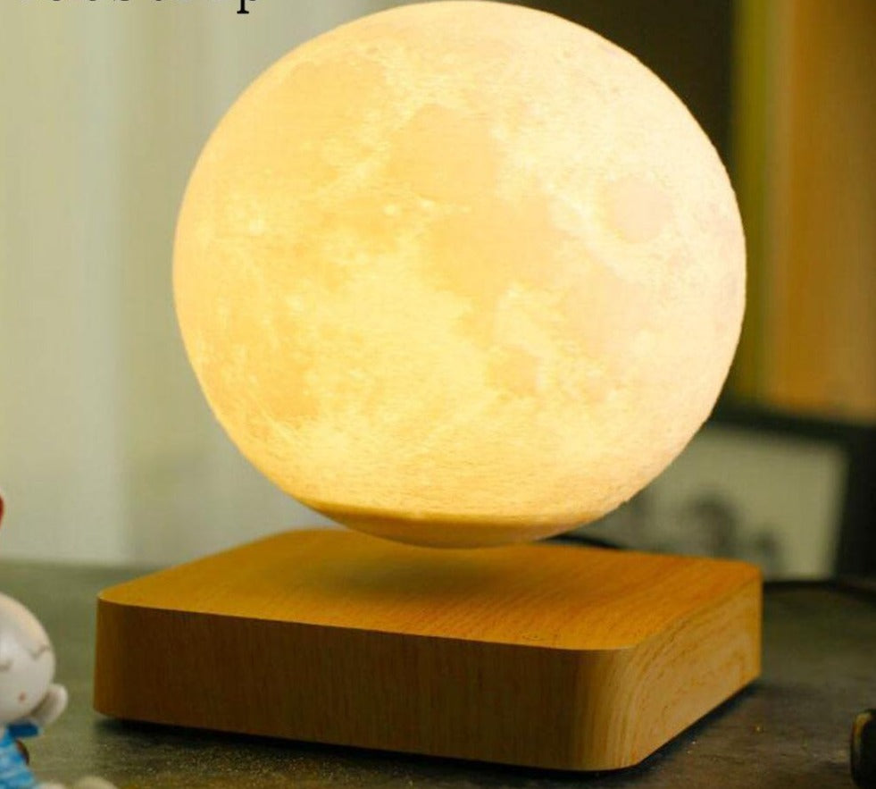 Magnetic levitating moon lamp glowing warm white